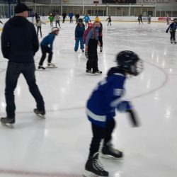 4-H members and family skating together