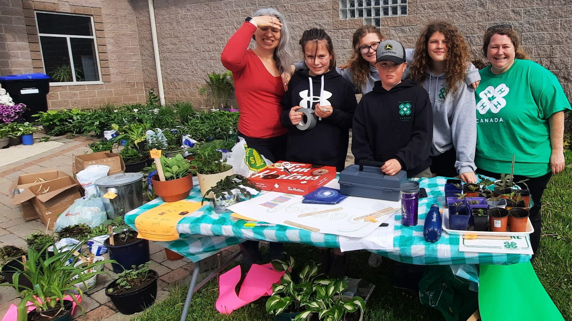 Members raising club funds by selling plants