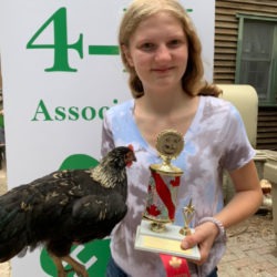 Member with champion 4-H cockerel