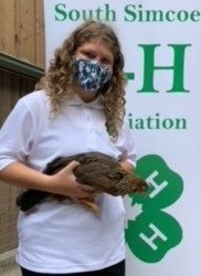 Member with her 4-H brown leghorn pullet