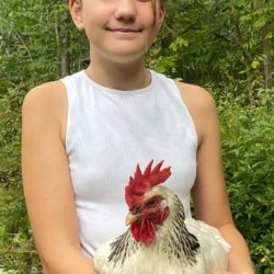 Poultry member with her Columbian Rock X hen