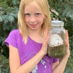 Cloverbud member with her meeting made jar composter