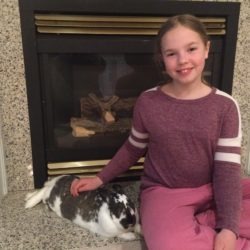 Member just relaxing with her 4-H rabbit