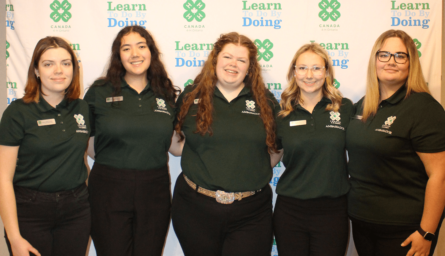 4-H Ontario ambassadors standing in front of backdrop