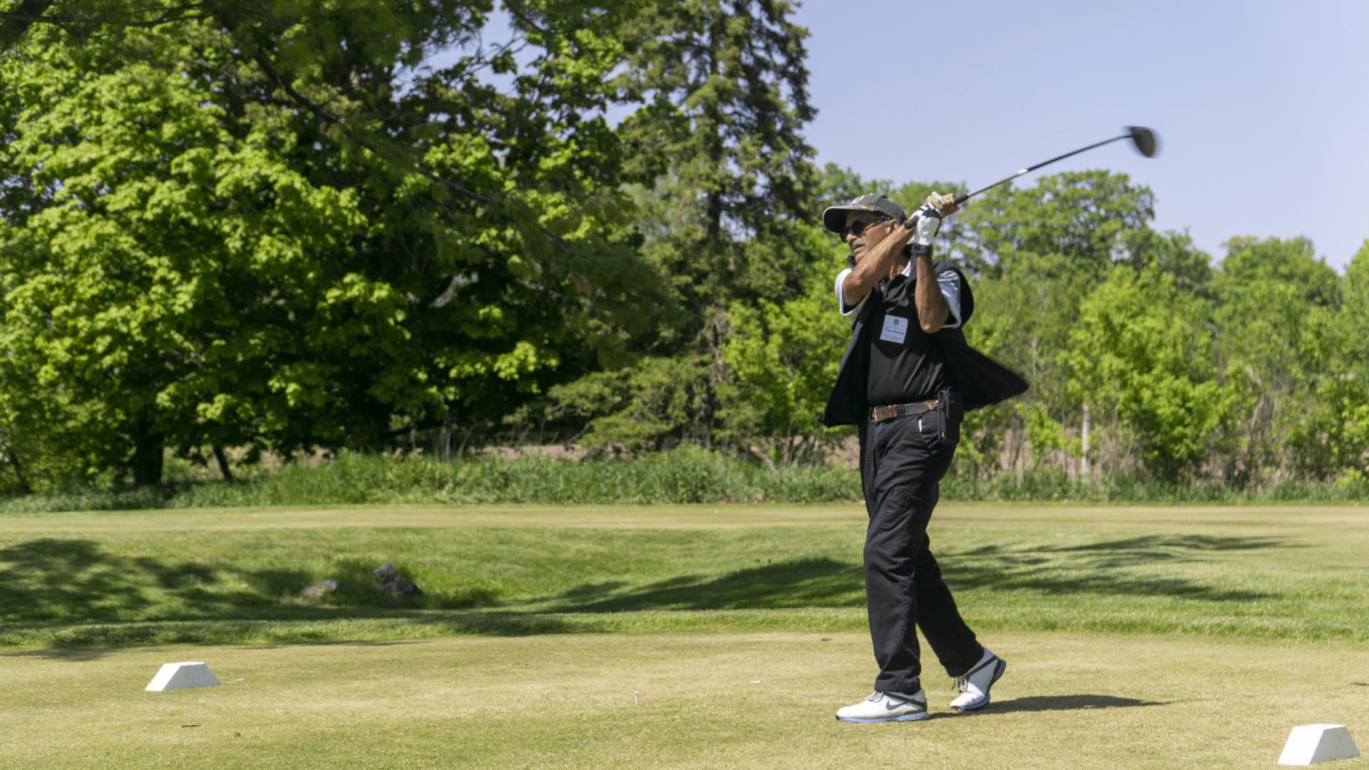 Golfer swinging his golf club. 